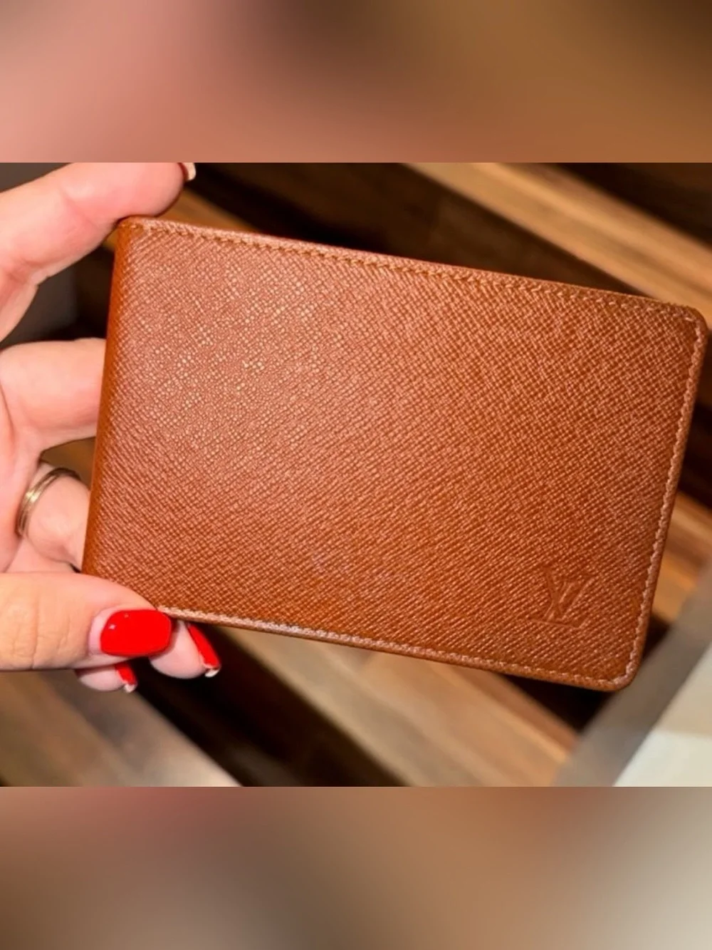 LOUIS VUITTON brown multiple bifold wallet in durable Taiga cross-grain leather